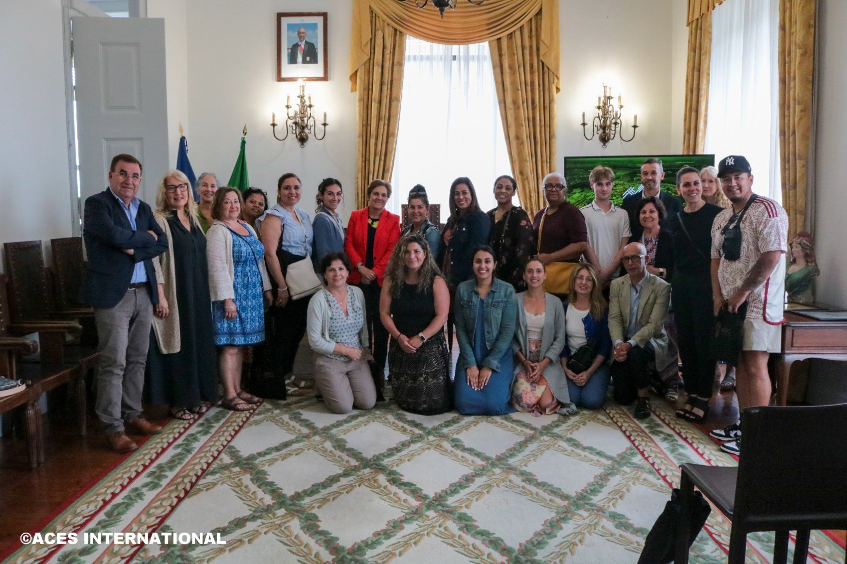 The entire Educators Field Study group takes a picture in a diplomatic office.